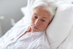 an older woman in a hospital bed