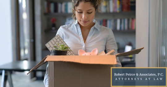 Woman moving office supplies into box