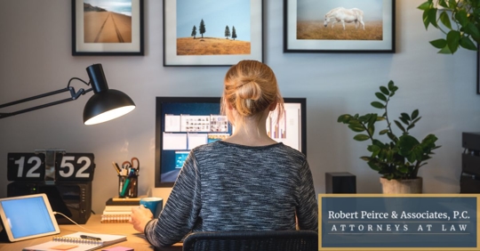 Woman working at her computer from home.