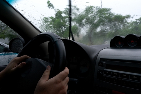 person driving during a storm