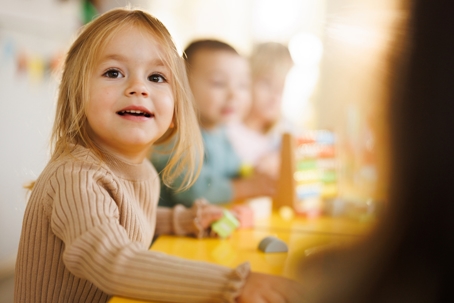 little girl playing in daycare