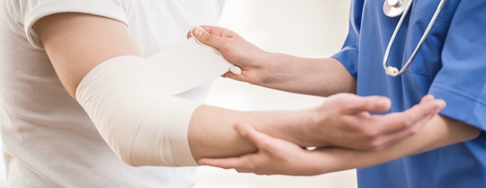 injured arm wrapping bandage