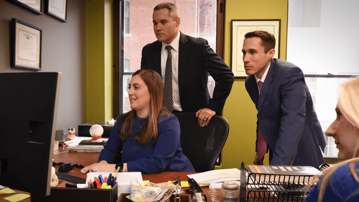 Robert Peirce Logo over desaturated image of office